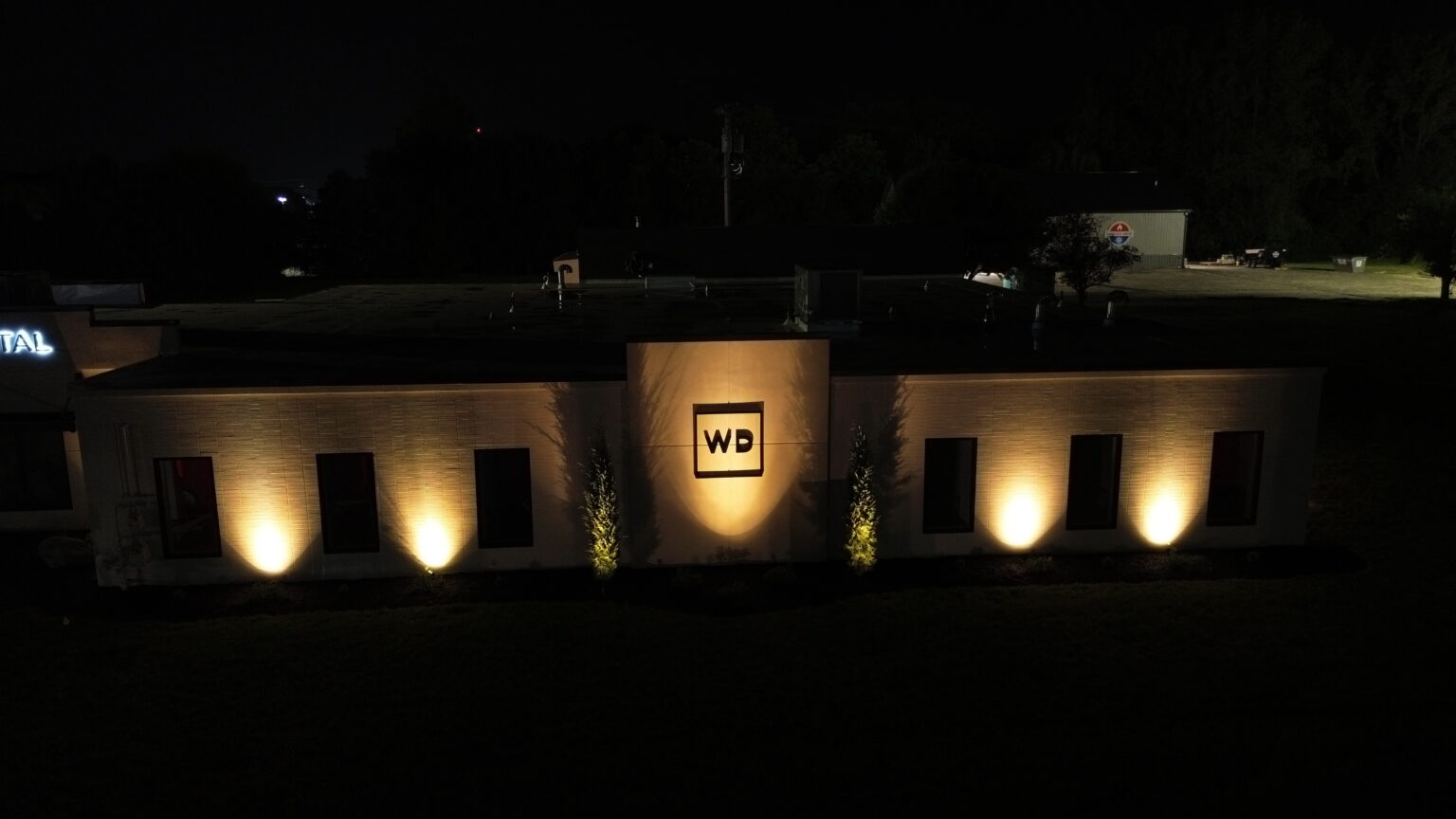 Facade uplighting and illuminated WD sign at Wharton Dental